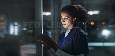 Buy stock photo Night, woman and nurse with tablet, typing and online reading for schedule, hospital and digital app. Results, medical or professional with tech, evening and website info with telehealth or internet