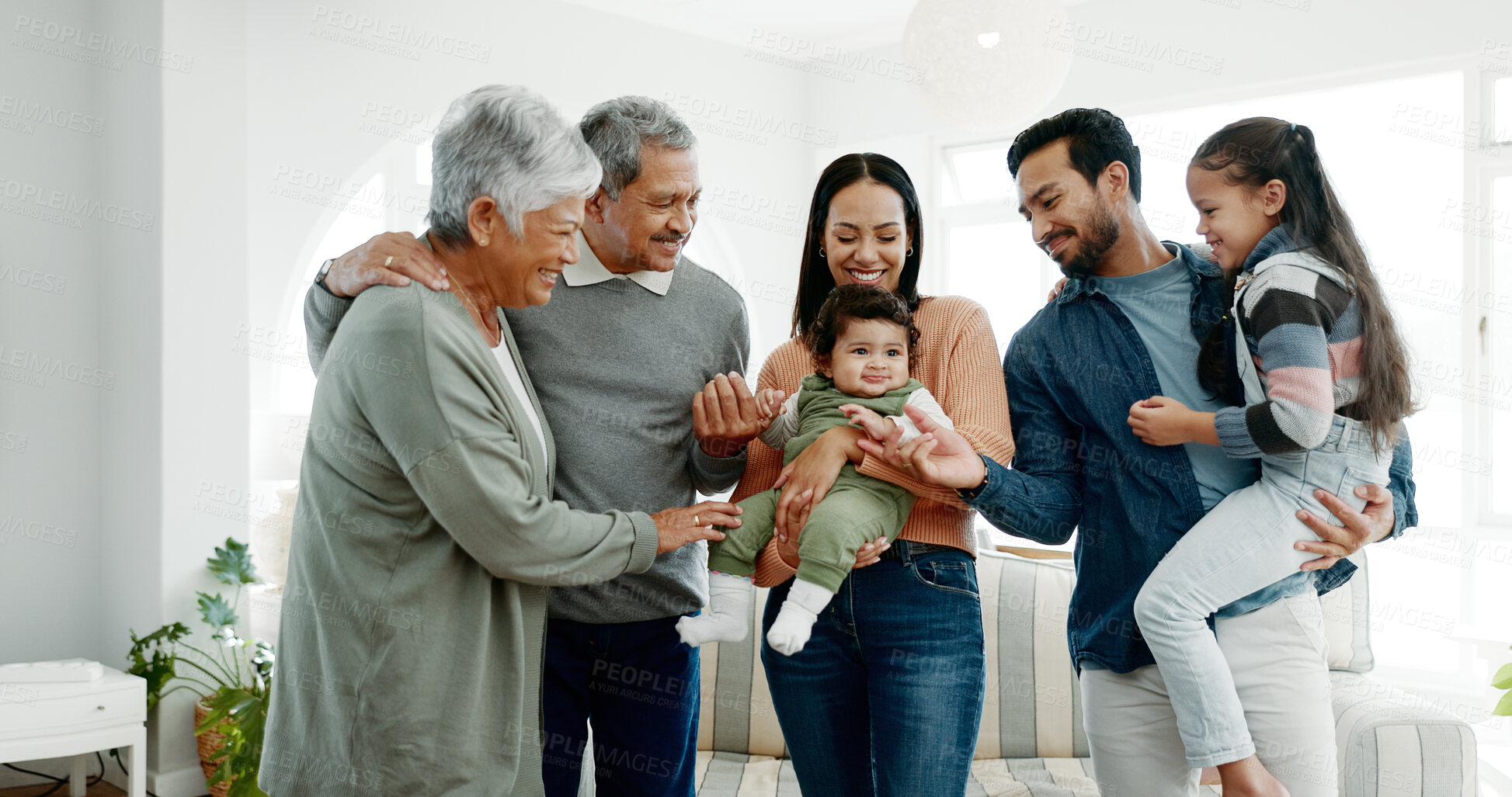 Buy stock photo Generations, family and happy with toddler at home for gathering, visit and bonding. People, grandparents and parents with kids on smile for support, care and trust or unity on break with hug