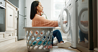 Buy stock photo Mother, baby and basket in kitchen for washing machine, housekeeping or motherhood in house with child. Woman, newborn and loading laundry for cleaning clothes, parenting and household responsibility