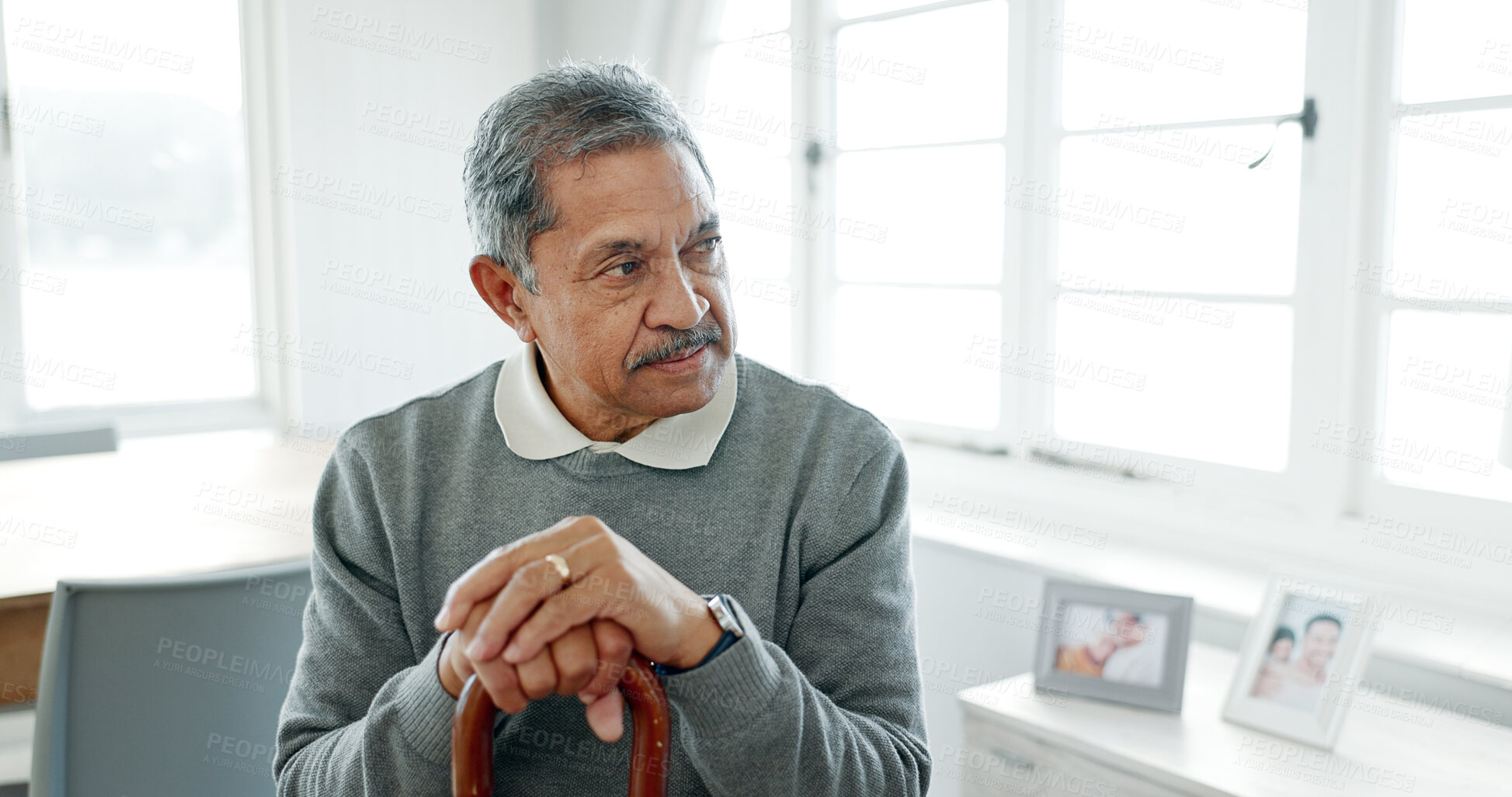 Buy stock photo Senior man, home and thinking with walking stick, wedding ring and grief in morning with memory of partner. Reflection, retirement and elderly person with disability, cane and remember in apartment