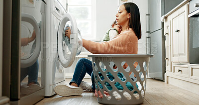 Buy stock photo Woman, baby and washing machine on floor, home and sleeping with care, clothes and multitasking. Mother, infant child and basket for laundry, hygiene and cleaning routine in morning at family house