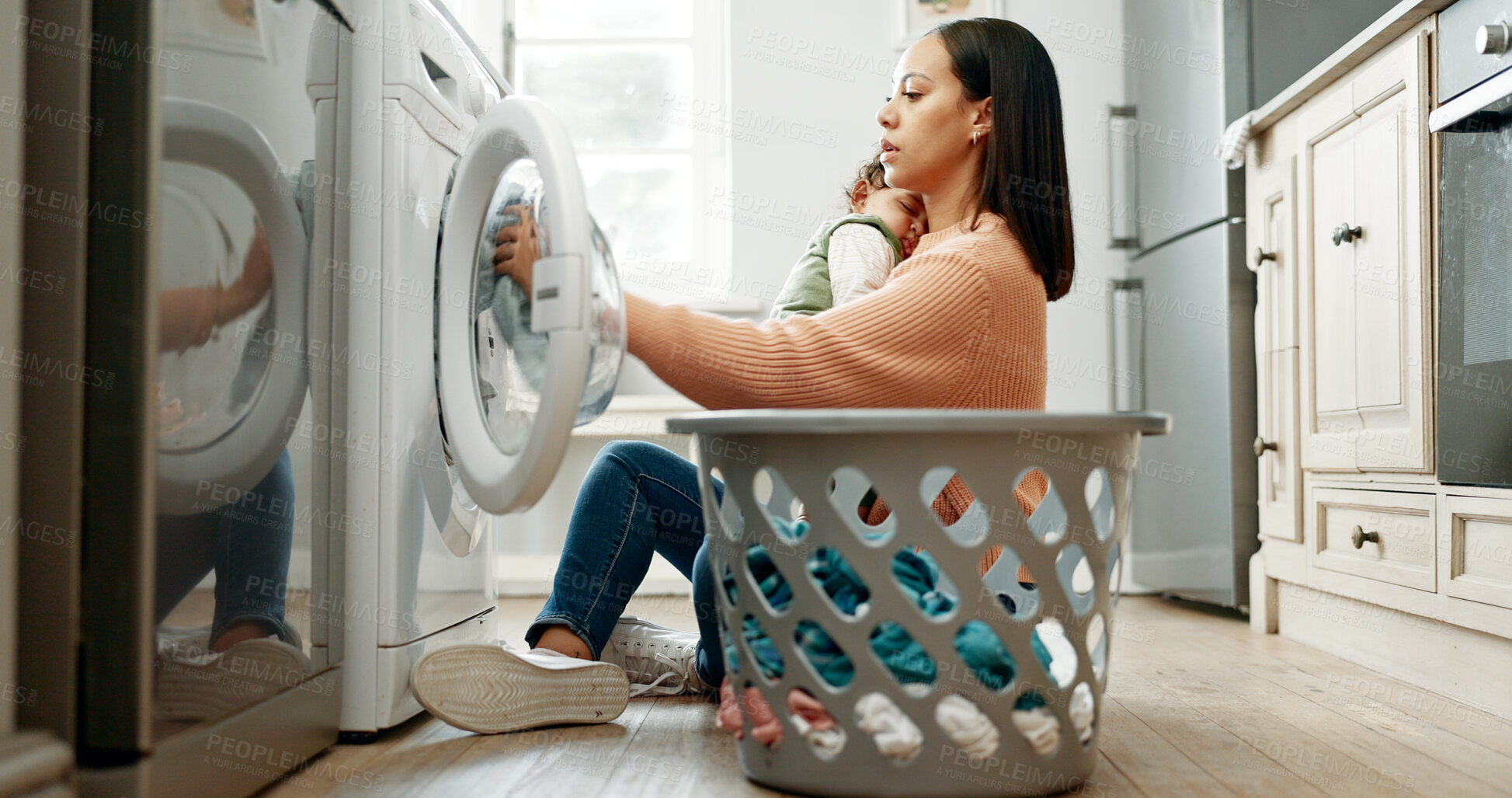 Buy stock photo Woman, baby and washing machine on floor, home and sleeping with care, clothes and multitasking. Mother, infant child and basket for laundry, hygiene and cleaning routine in morning at family house