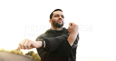 Buy stock photo Fitness, stretching and thinking with sports man getting ready for start of cardio training outdoor. Arms, exercise and warm up with confident person in nature for marathon or workout routine