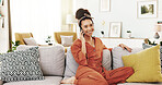 Woman, phone call and happy on sofa in home, relax and conversation with mobile network in lounge. Person, girl and smile with smartphone, contact and memory with chat in living room at apartment