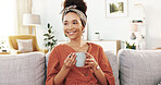 Woman, smile and coffee on sofa with thinking, reflection and start morning in apartment. Girl, person and tea cup with memory, insight and drink with nostalgia on living room couch at modern house