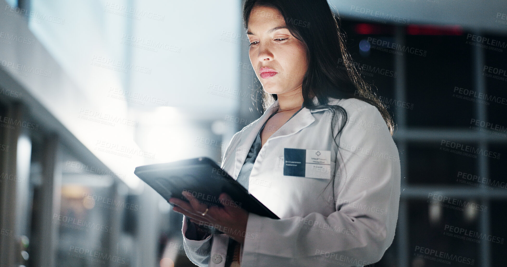 Buy stock photo Woman, doctor and night with tablet for research, medical data or new discovery at hospital. Young, female person or healthcare employee working late on technology for medicinal information at clinic