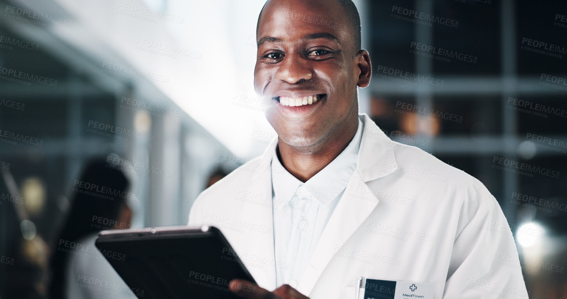 Buy stock photo Black man, doctor and tablet at hospital, portrait and night with report, results and medical research. Person, medic and app with digital touchscreen for review, feedback and healthcare in Nigeria