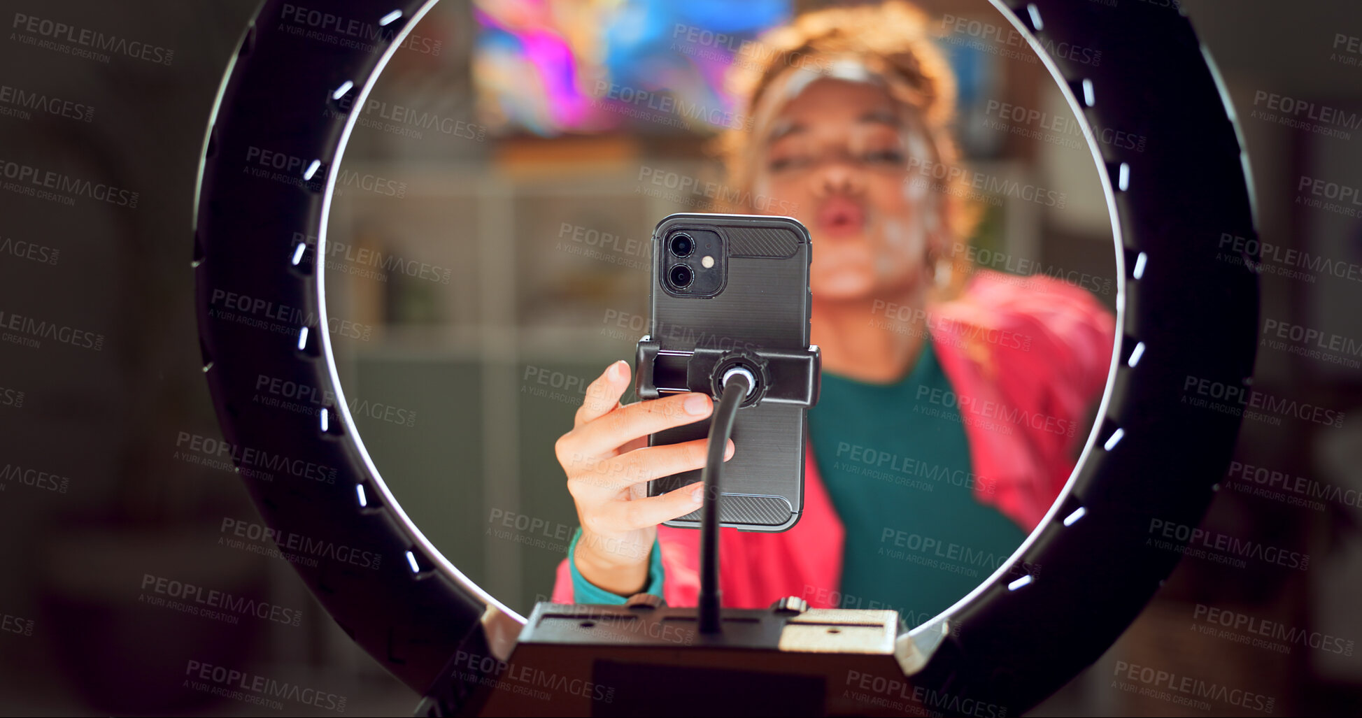 Buy stock photo Happy woman, influencer and phone with ring light for content creation, video recording or online tutorial at home. Young, female person or vlogger on mobile smartphone for kiss, like and subscribe