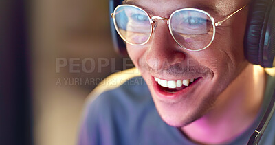 Buy stock photo Happy man, face and gamer with headphones for esport, online tournament or streaming at home. Young, male person or streamer with smile or headset at night for fun console or computer gaming at house