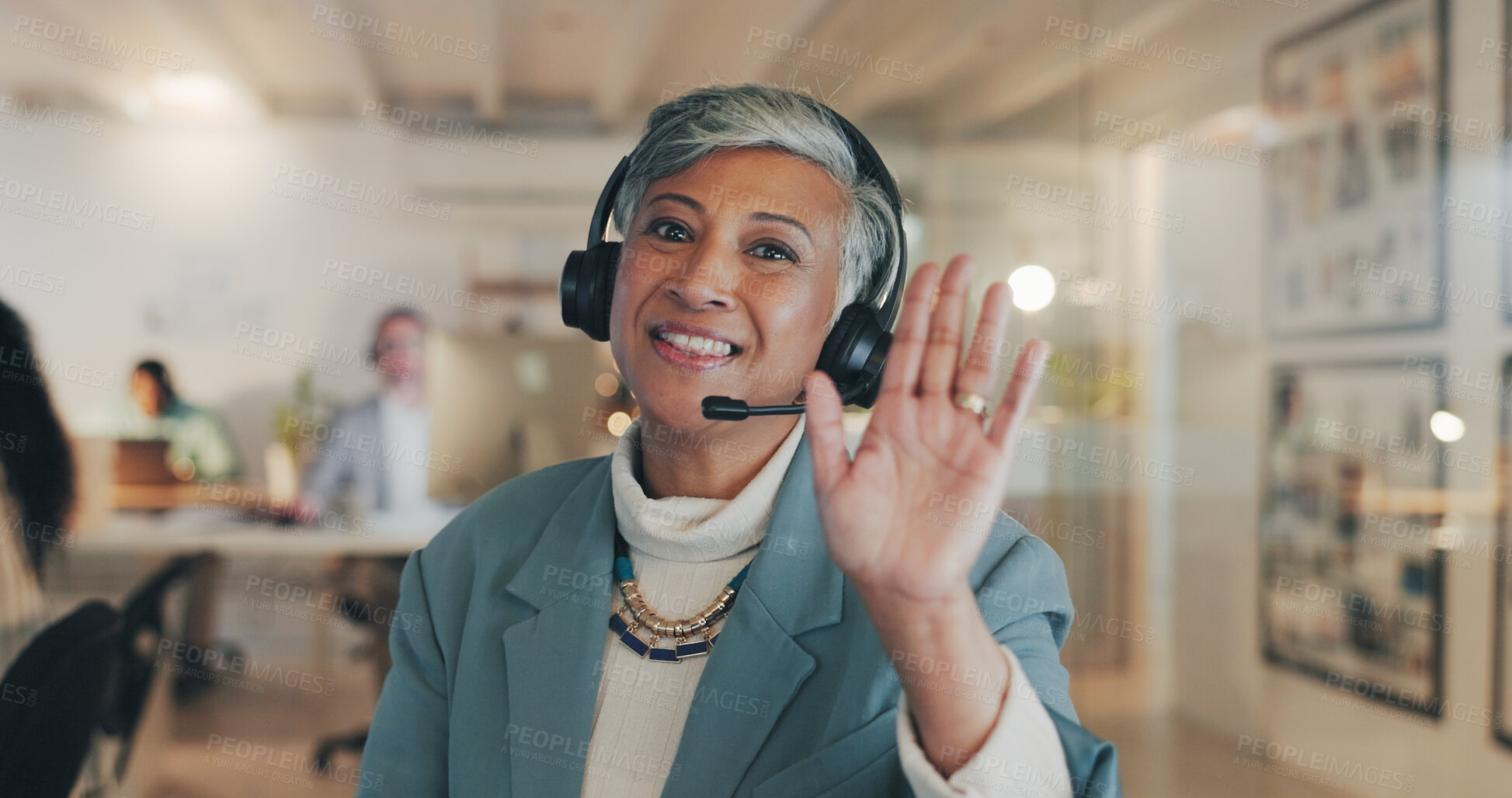 Buy stock photo Woman, video call and portrait for wave, headset or happy for communication, contact us and tech support. Mature person, agent and webinar with palm, hello and smile for customer service in office