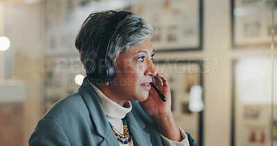 Buy stock photo Mature woman, call center and talk at night with mic, headphones and customer support at telemarketing agency. Person, agent and consultation with voip tech, thinking and advice at modern office