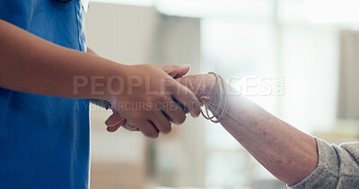 Buy stock photo Caregiver, senior patient and holding hands at nursing home for support, care and empathy on retirement. People, nurse and elderly person in closeup for kindness, trust and healthcare as pensioner