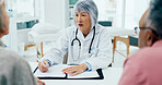 Mature woman, doctor and writing with elderly couple for consultation, checkup or prescription at hospital. Female person, surgeon or medical employee taking notes with senior clients for healthcare