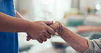 Nurse, elderly care and holding hands with patient for empathy, understanding or support at retirement home. Closeup, medical caregiver or doctor with touch for grief, loss or trust at old age house