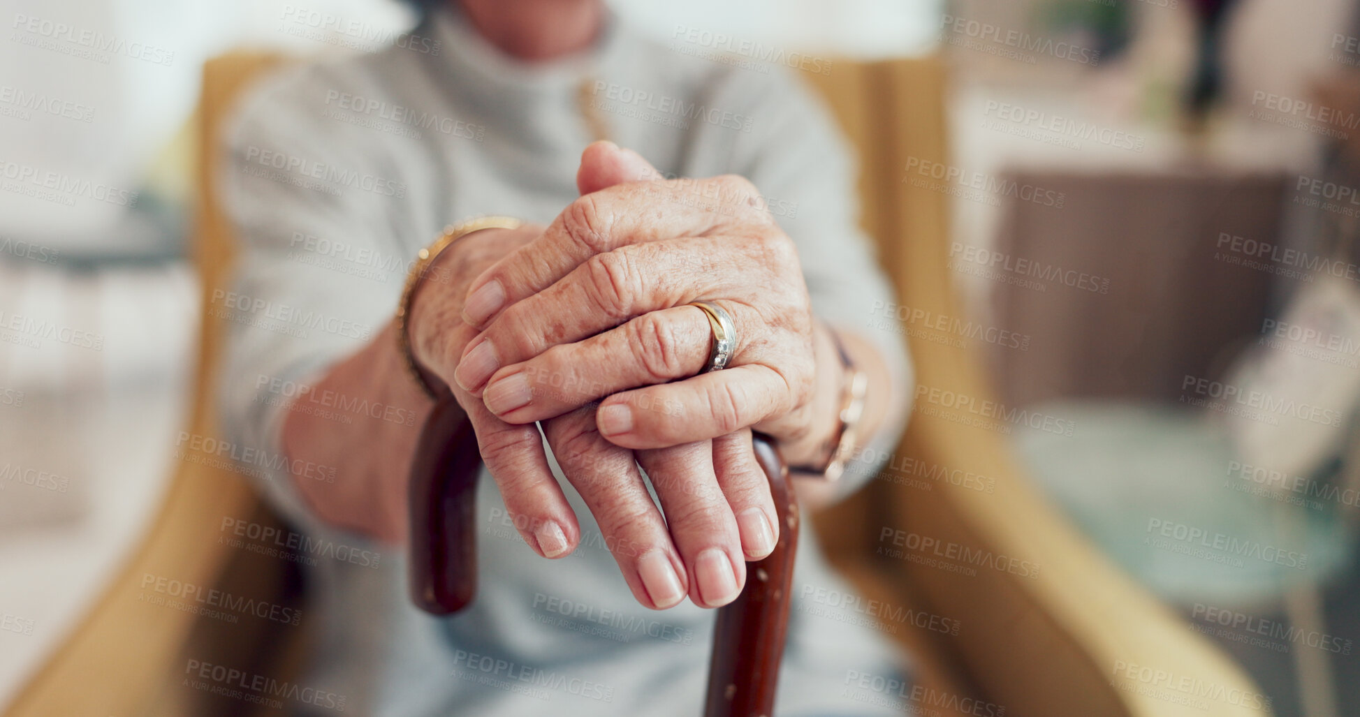 Buy stock photo Hands, cane and sofa in home for senior person with  disability, mobility and recovery from stroke. Elderly care, walking stick and support for steps, balance and relax on living room couch in house