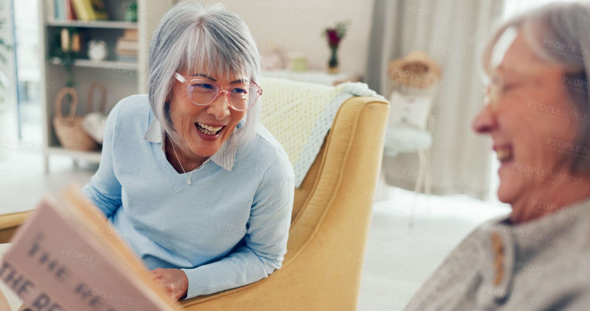 Buy stock photo Mature woman, friends and laughing with book in retirement home for holiday, weekend or reading club. Senior women, laughter and joy with story for funny joke, humor or comedy novel at old age house