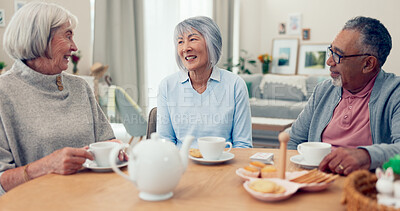 Buy stock photo Talking, tea and senior group at table for conversation, snacks and retirement together in house. Happy friends, party and man speaking with elderly women for breakfast, communication and bonding