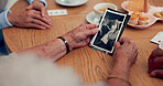 Hands, picture and senior people in home with memory, remember or reminiscing in conversation. Talking, photograph and group of elderly friends in discussion for past reflection together in house.