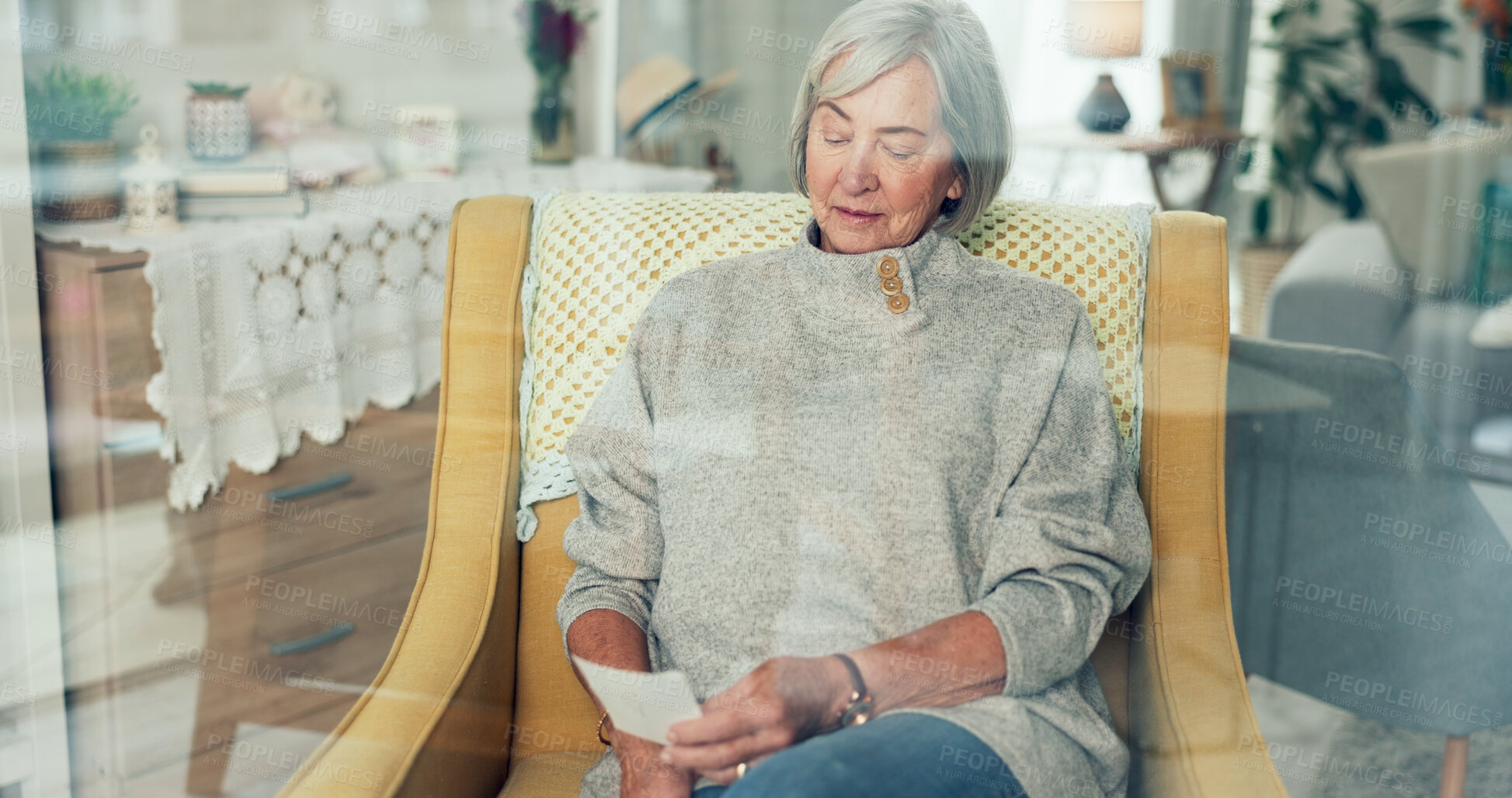 Buy stock photo Senior woman, picture and memory in retirement home with nostalgia, peace and calm. Elderly lady, relax and thoughtful in living room on sofa with gratitude, mindfulness and idea on lounge couch