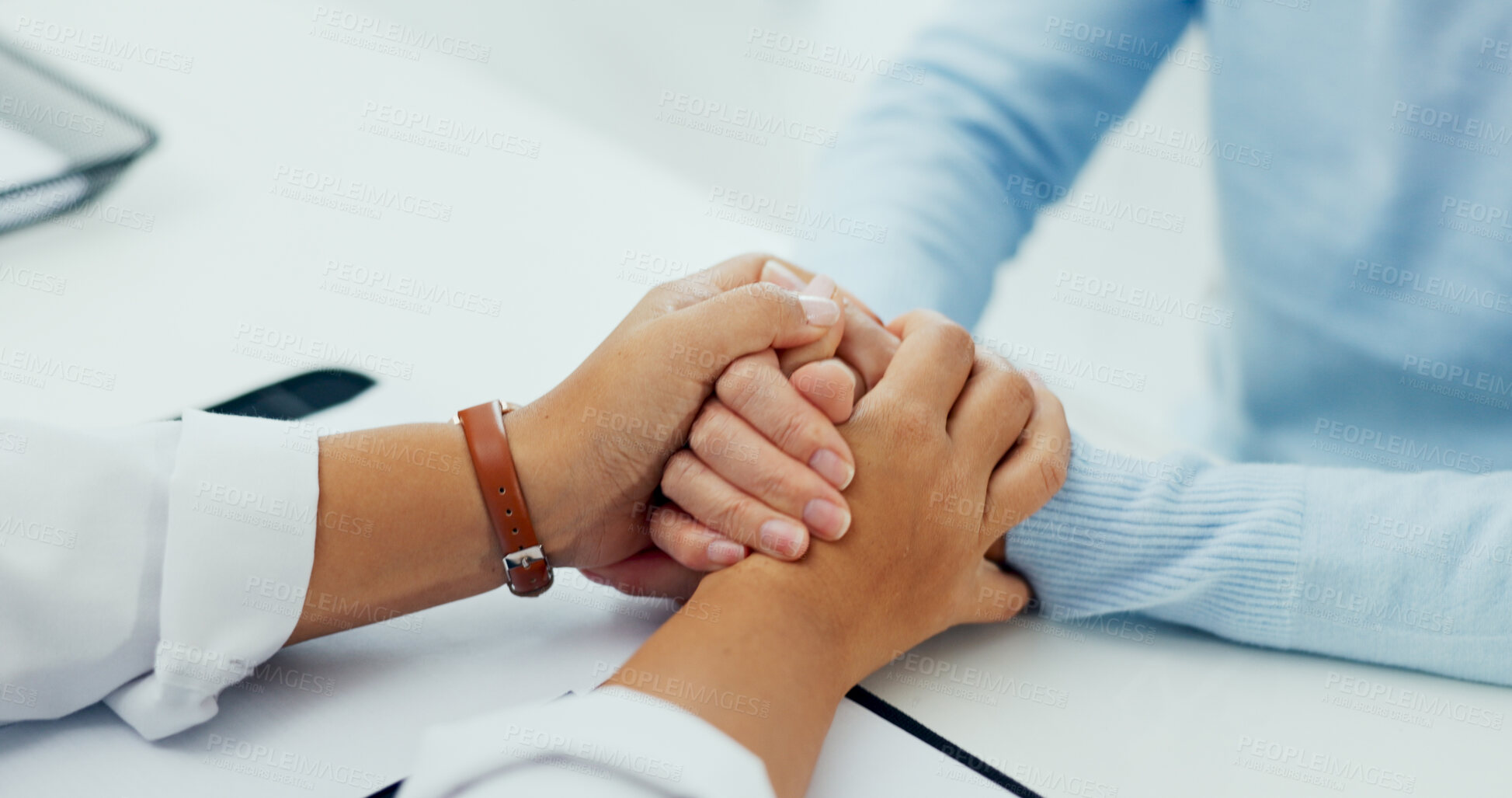 Buy stock photo Holding hands, doctor and patient on consultation with support for feedback or report on diagnosis. People, medical practitioner and closeup for advice, help and communication with kindness at clinic