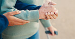 Park, walking and hands of caregiver with senior person for assisted living, support and care in nature. Retirement, help and elderly person with disability outdoors for wellness, health and recovery