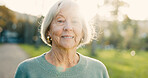 Senior, woman and happy in portrait outdoor for morning walk, wellness and confidence in retirement. Elderly person, face of pensioner and smile in nature for relax, fresh air and pride in street