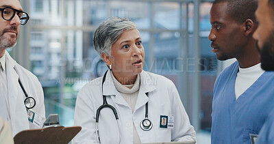 Buy stock photo Meeting, advice and doctors in hospital with clipboard, schedule and serious discussion in lobby. Healthcare, men and woman together with nurses for planning, consulting and medical team in clinic