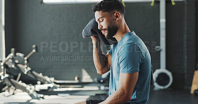 Buy stock photo Break, fitness and sweating with man in gym for challenge, sports training or workout. Exhausted, fatigue and towel with tired athlete person in health club for recovery or rest from exercise