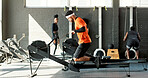 Man, rowing machine and fitness with workout at gym, benefit or training for muscle development. Person, exercise and routine for challenge, start or progress for body transformation at wellness club