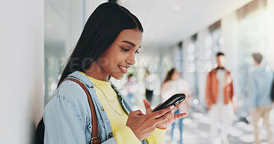 Buy stock photo Student, mobile or smile in hallway for contact, text and good news on social media. Girl, phone or connected in university for communication, class schedule or happy for academic review on internet