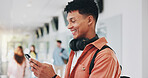 Campus, results or happy man with phone in university for learning application or education. Social media text, mobile or proud student on internet for academic registration or scholarship test marks
