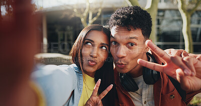 Buy stock photo Happy couple, portrait and peace sign with selfie for photography, memory or picture at outdoor campus. Young, man and woman with funny face for playful moment or friendship together at university