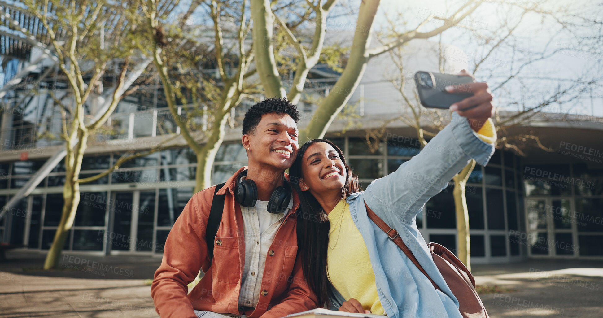 Buy stock photo Happy students, friends and hug with selfie for photography, memory or picture at outdoor campus. Young, man or woman with smile in joy for moment, capture or friendship together at university