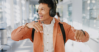 Buy stock photo Student, music or smile in university for dance, energy or positive attitude in morning. Man, headphones or freedom in lobby with tech, creativity and streaming favorite song on campus for good mood