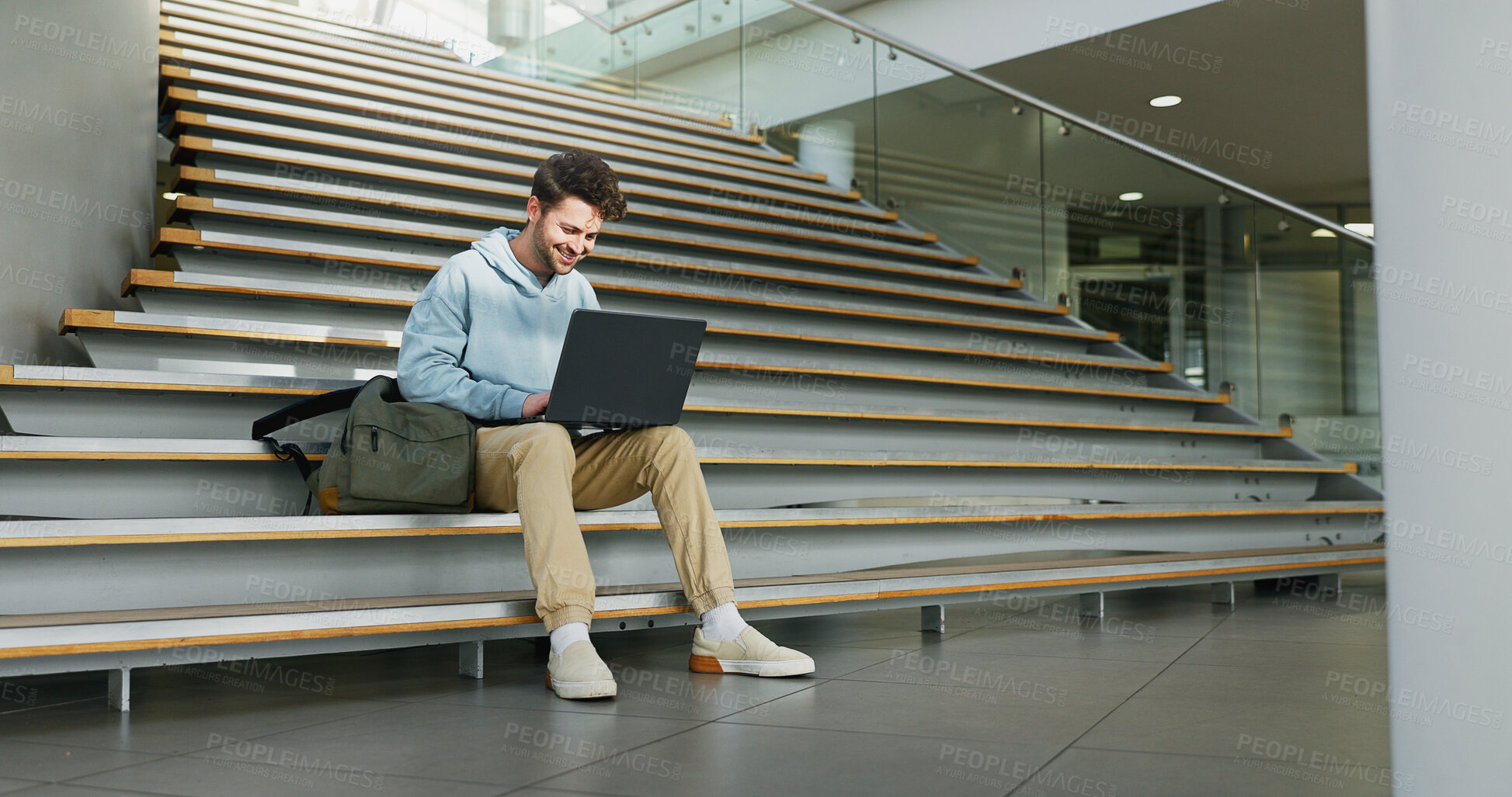 Buy stock photo Man, stairs and student on laptop for learning, assignment and books for studying on campus. Male person, online research and university for knowledge, website and registration at college institute