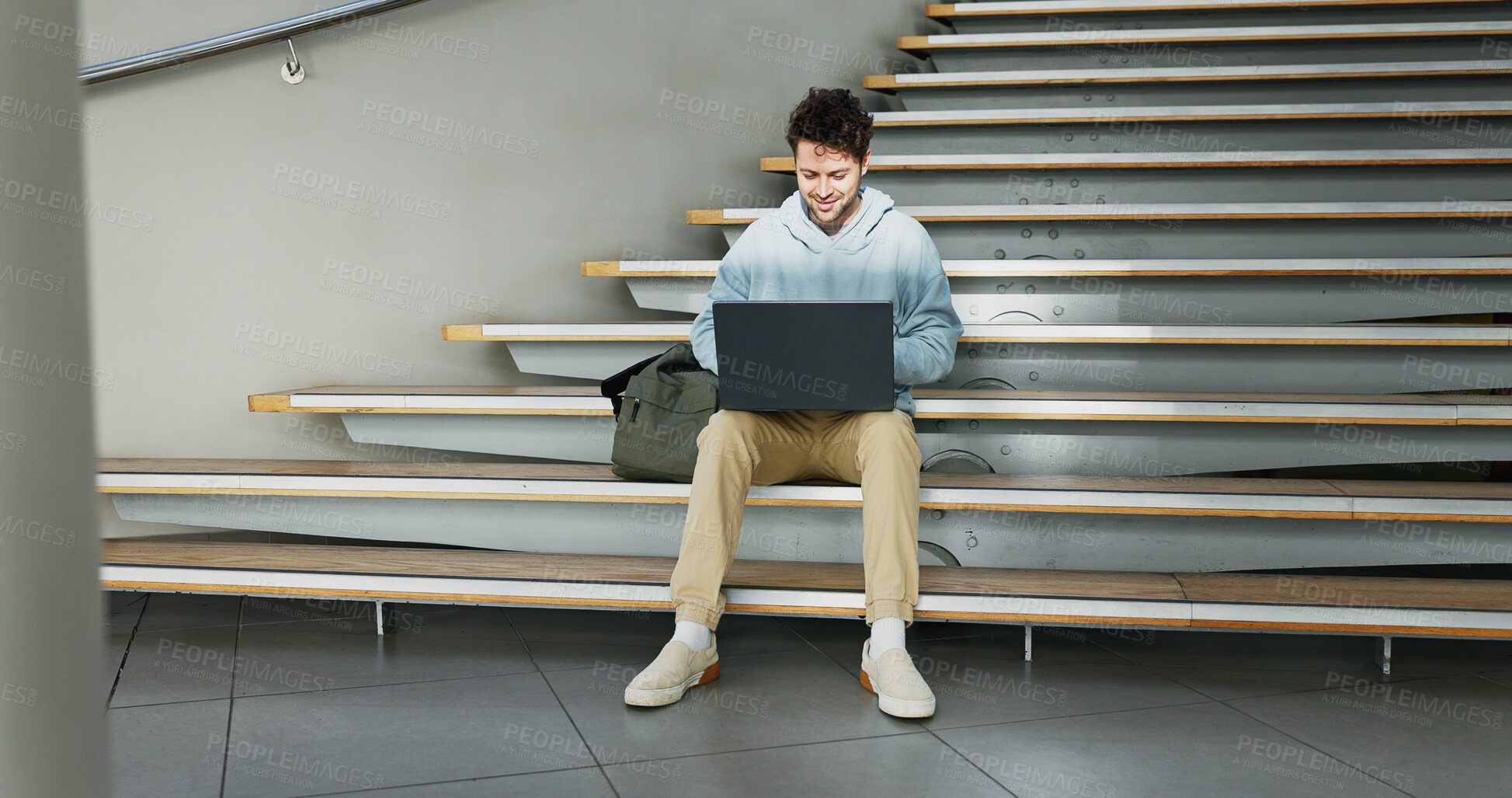 Buy stock photo Man, stairs and student on laptop for education, learning and books for studying on campus. Male person, online research and university for knowledge, website and registration at college institute