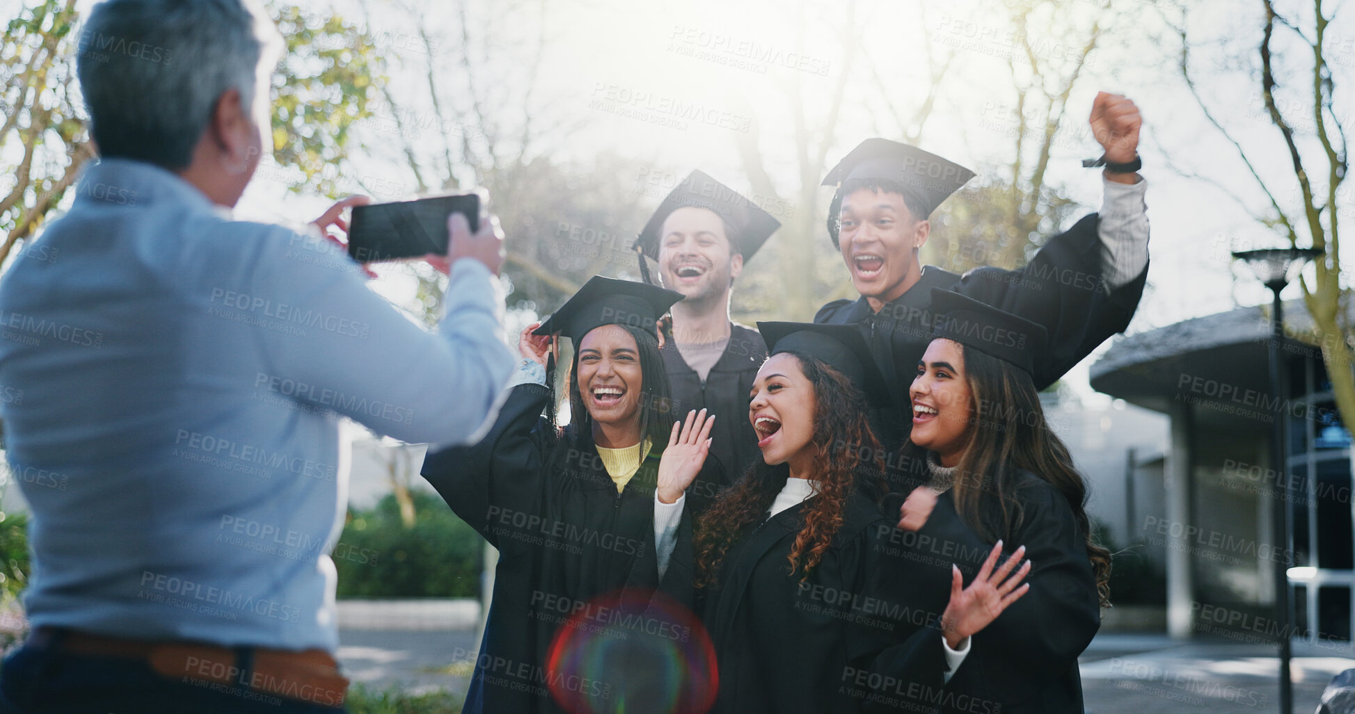 Buy stock photo Students, graduation or celebrate on campus for photography, fun or happy for achievement. Friends, class or excited outdoors for event, academic success or taking picture for yearbook or local news