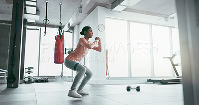 Buy stock photo Fitness, woman and squat with band at gym for muscle building, exercise and workout of cardio training. Active, female person and morning routine, wellness and glutes progress for legs performance