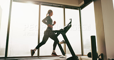 Buy stock photo Woman, fitness and running on treadmill at gym for cardio exercise, workout and training performance. Active, female person and machine for morning routine, endurance or speed challenge of resilience