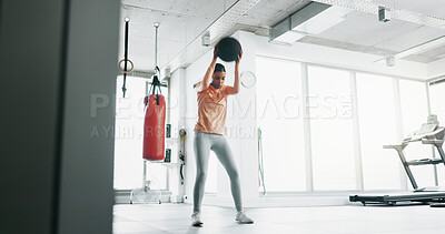 Buy stock photo Woman, active and medicine ball for fitness at gym with bouncing exercise, strong muscle and training performance. Female person, gear and cardio workout for sports progress, resilience and wellness