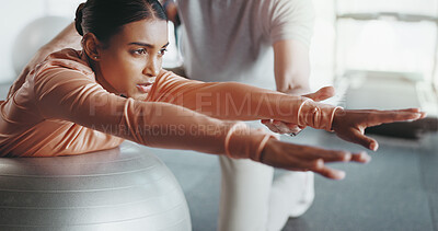 Buy stock photo Ball, woman and personal trainer in gym for balance, rehabilitation and stability training. Girl, person and physiotherapy in fitness center for core strength, yoga practice and help in exercise