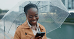 Business, black woman and phone with umbrella for rain weather, communication and social media of security. Smile, female person and mobile for texting, search location and taxi app of travel outdoor