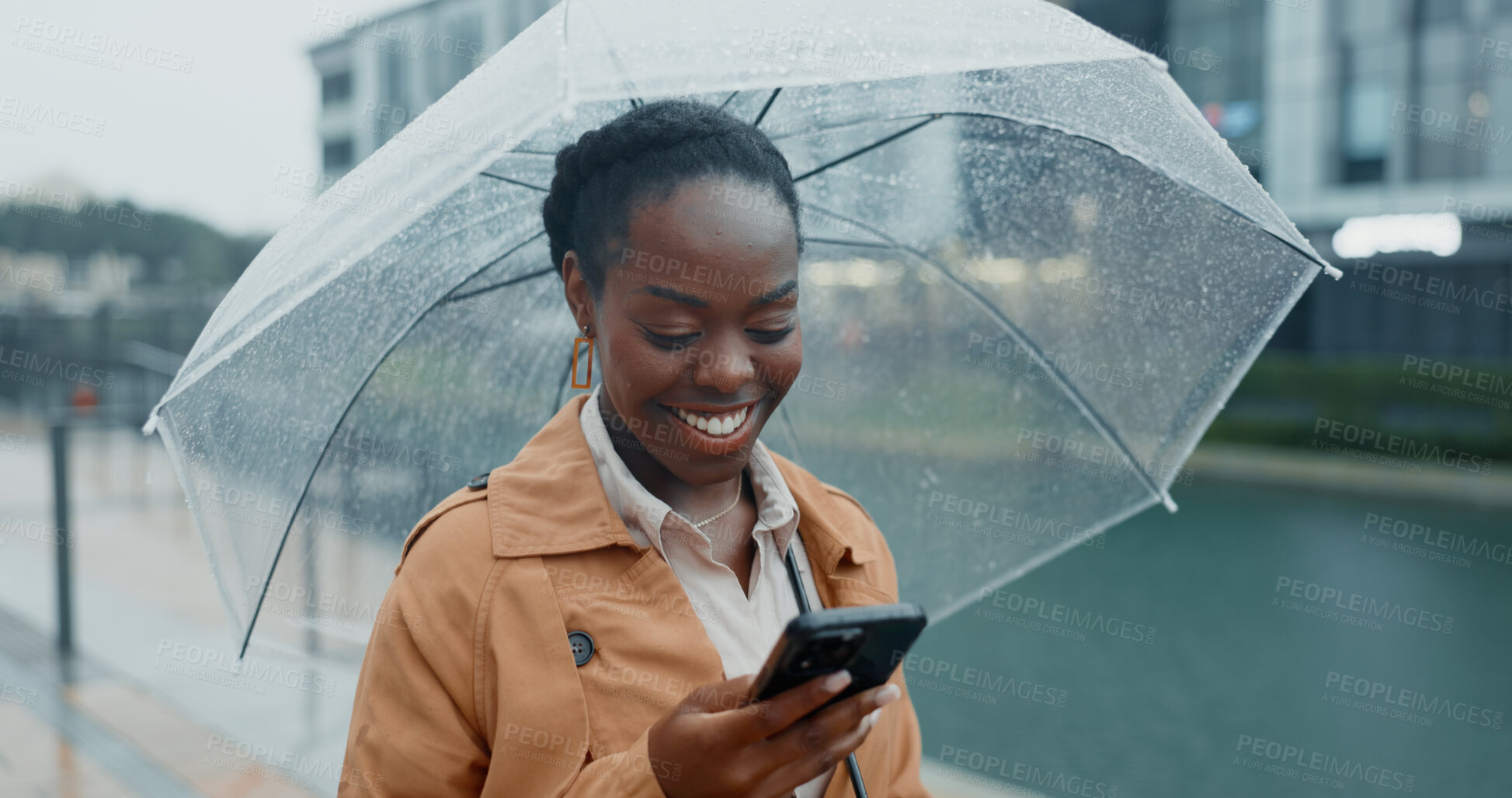 Buy stock photo Black woman, travel and phone with umbrella for rain weather, communication and social media of security. Smile, female person and mobile for texting, search location and taxi app of commute outdoor