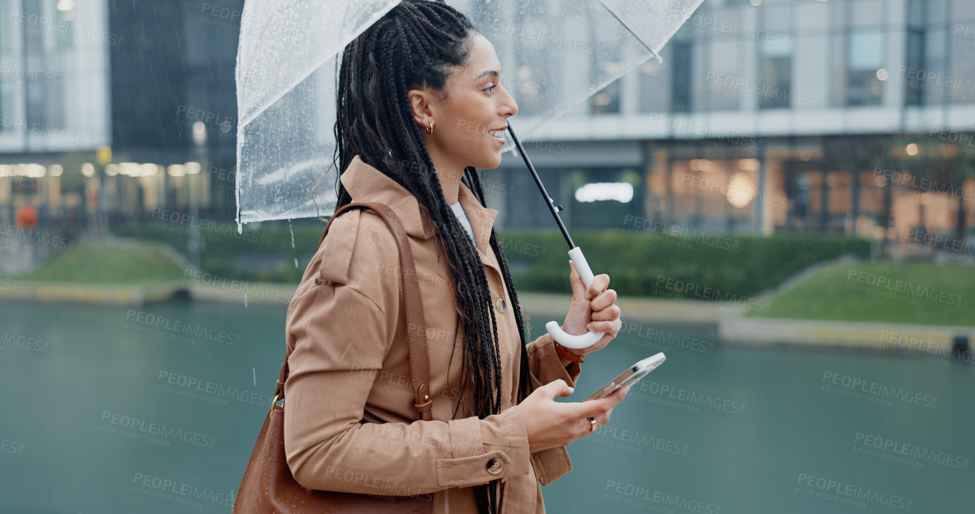 Buy stock photo Woman, outdoor and smile with umbrella on smartphone with rain drops or commute for job interview. Female employee, profile and smile on internet with map for direction or navigation for direction