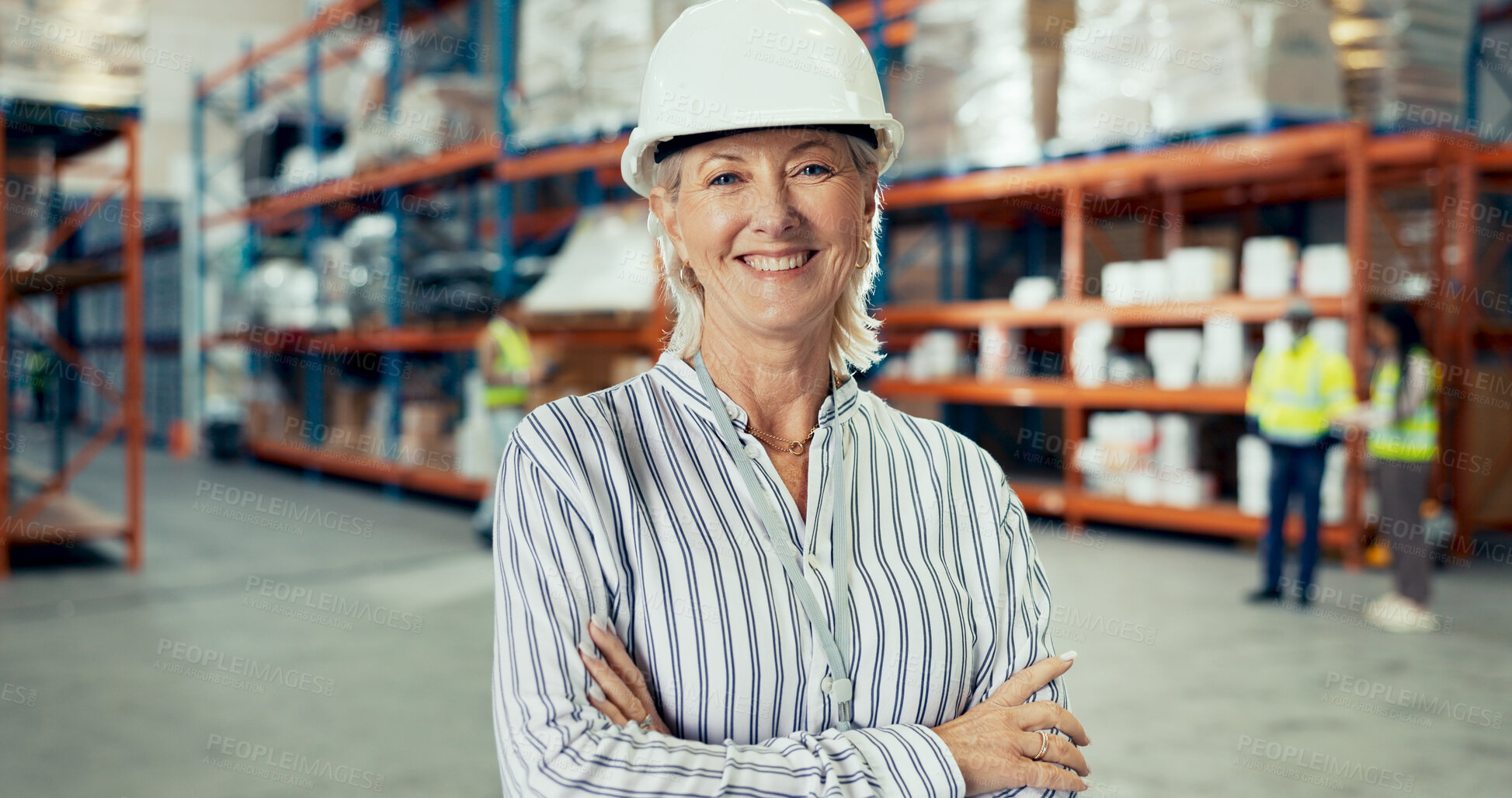 Buy stock photo Logistics, mature woman and confident in warehouse with portrait, freight and distribution. Operations manager, arms crossed or pride in storage facility with team, export or shipping in supply chain