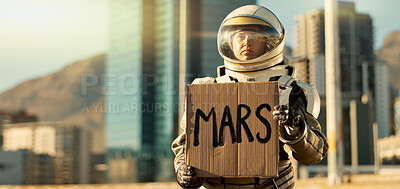 Buy stock photo Person, astronaut and outdoor with poster or mars text in city for scientific research, evacuation and migration. Spacesuit, outside and serious with sign board for signal, alert and awareness