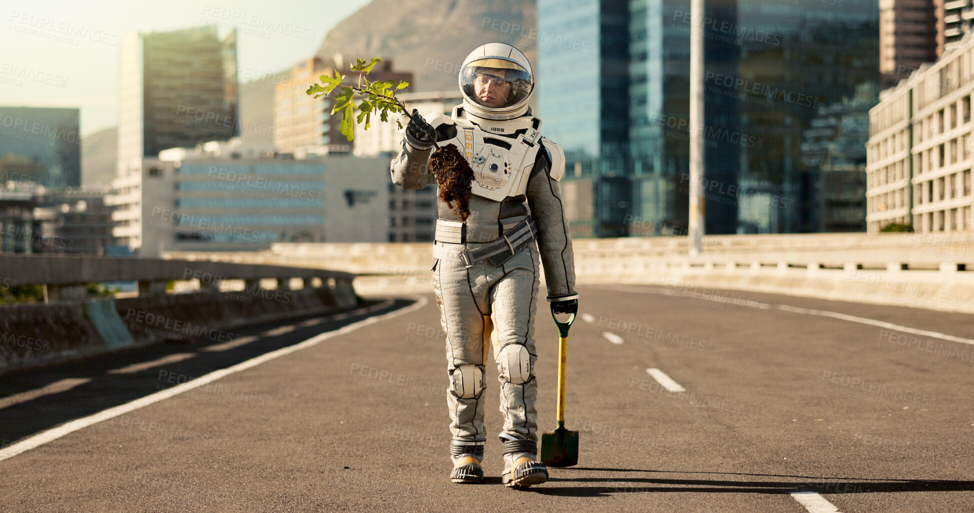 Buy stock photo Nature, astronaut in suit and plant on planet for oxygen, earth restoration and futuristic fantasy in street. Spaceman, spade and walking with tree in road for growth, exploration and adventure