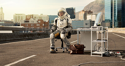 Buy stock photo Earth, scifi and astronaut in spacesuit, cyberpunk and city with buildings, laptop and dystopia. Urban town, person and explorer with computer, future and artistic with planet, mission or creative