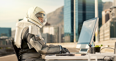 Buy stock photo Technology, astronaut and helmet with computer on planet for discovery, research and science fiction information. Spaceman, outdoor desk and typing in street for expedition and futuristic fantasy