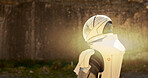 Astronaut, outdoor planet and helmet for adventure to explore earth, mountain mission or discovery. Spaceman, lens flare and search environment for journey, futuristic fantasy and travel expedition